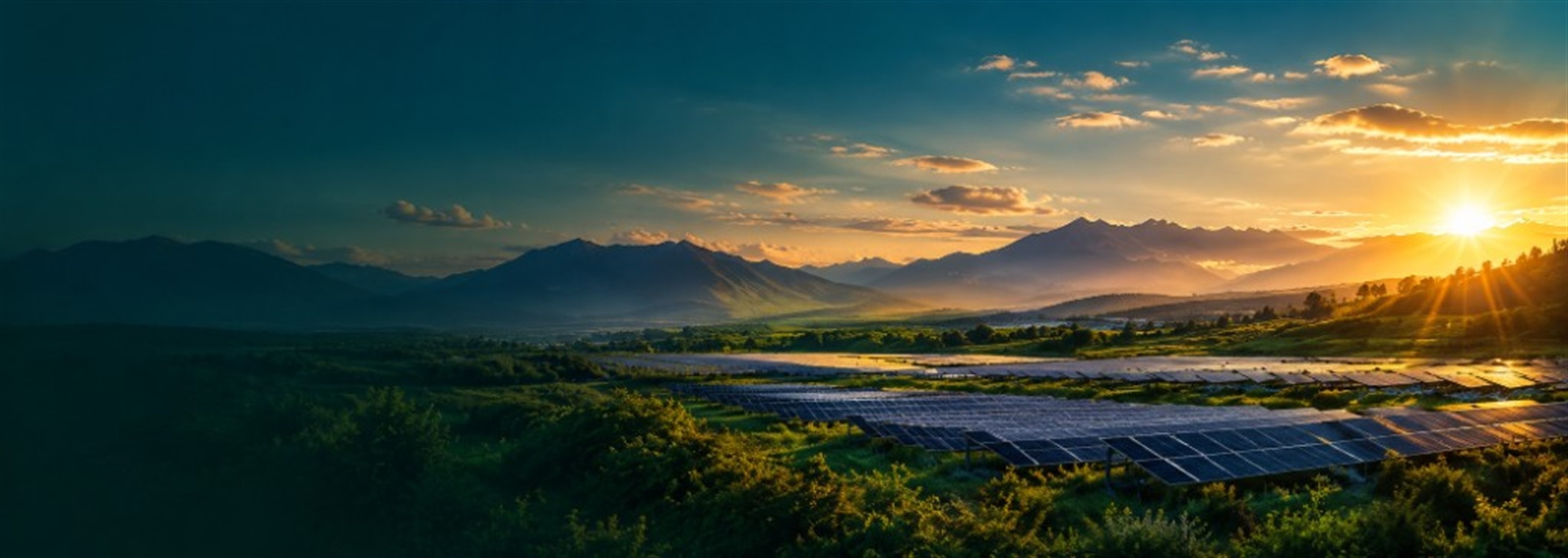 TAEKMO solar farm valley at sunset with golden light and mountains